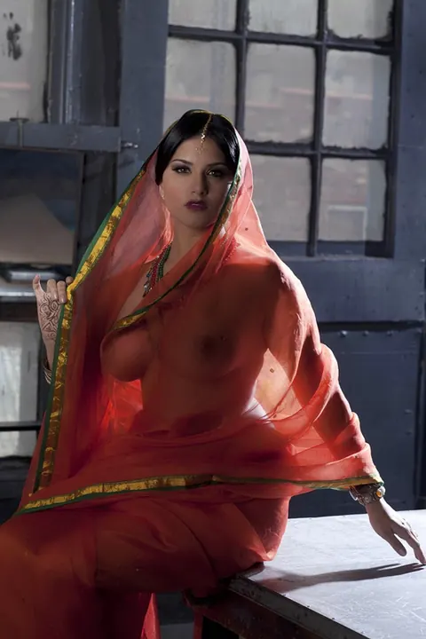 Sunny Leone: Busty Indian MILF Strips Out of Her See-Through Attire – photo 14 of 15