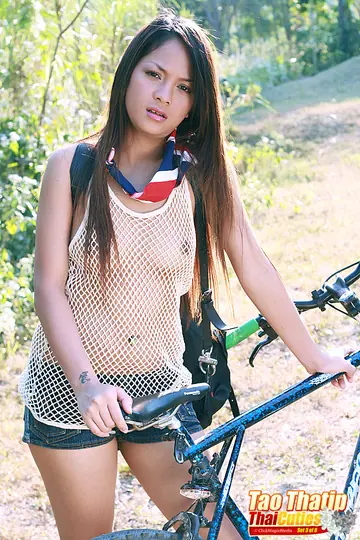 Tao Thatip – Thick Asian Brunette with a Big Ass Poses Naked in Boots Outdoors
