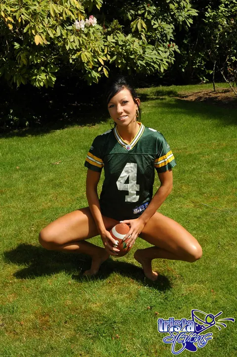 Trista Stevens: Brunette Amateur Strips Bottomless While Tossing a Football Outdoors – photo 2 of 12