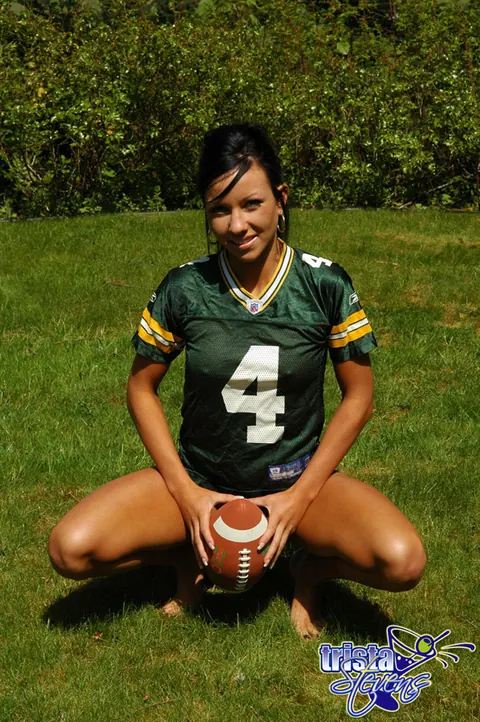 Trista Stevens: Brunette Amateur Strips Bottomless While Tossing a Football Outdoors – photo 4 of 12