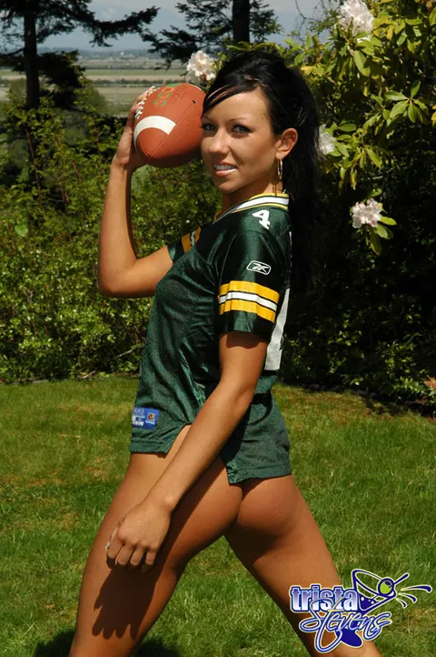 Trista Stevens: Brunette Amateur Strips Bottomless While Tossing a Football Outdoors – photo 8 of 12