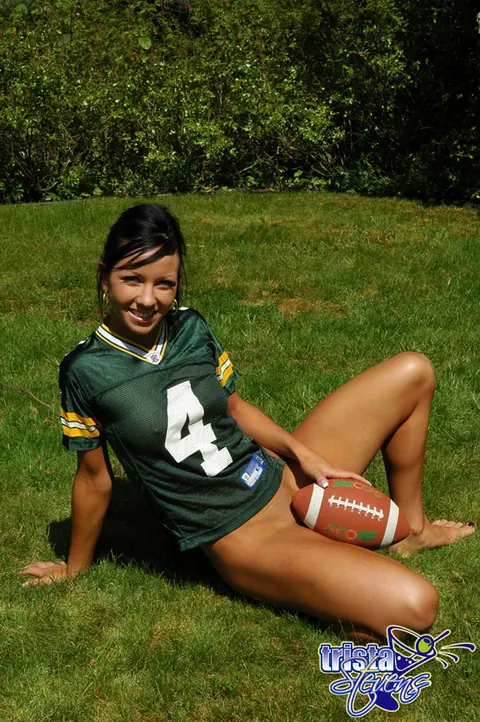 Trista Stevens: Brunette Amateur Strips Bottomless While Tossing a Football Outdoors – photo 9 of 12