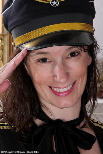Brunette MILF Strips Off Her Pilot Uniform and Spreads Her Shaved Pussy