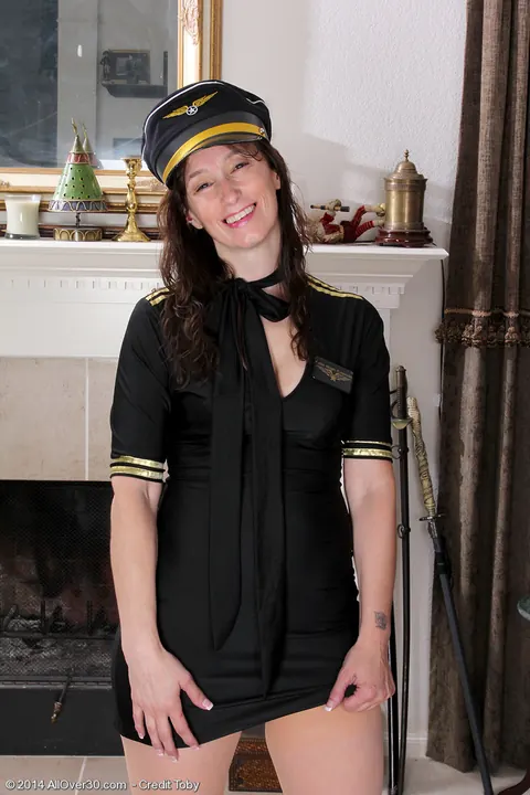 Celeste Carpenter: Brunette MILF Strips Off Her Pilot Uniform and Spreads Her Shaved Pussy – photo 5 of 16