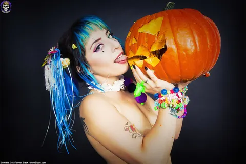 Woman with Pigtails Strips While Carving a Pumpkin and Spreads – photo 8 of 15