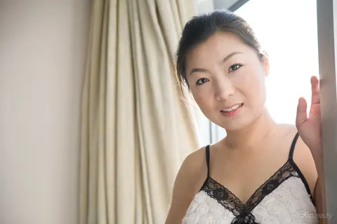 Mature Asian Brunette Spreads Her Hairy Pussy at the Window – photo 3 of 16