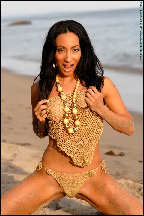 Monica Goe: Busty Latina Poses in a Bikini and Strips Topless on the Beach – photo 15 of 15