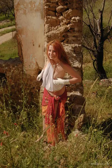 European Redhead Spreads Her Legs Outdoors by a Ruined Building