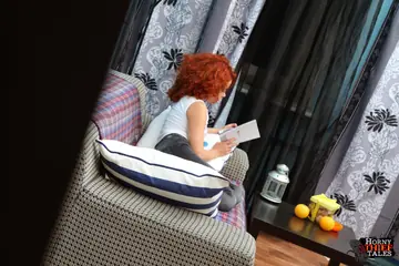 Curly Redhead Sucks Two Men and Gets Fucked on the Sofa