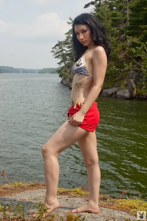 Tattooed Woman Strips Out of Her Bikini and Poses by the River – photo 1 of 15