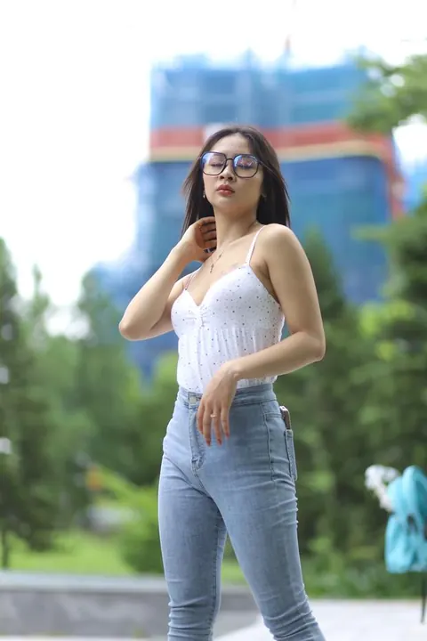 Asian Woman Poses Outdoors in Tight Jeans and a White Top – photo 12 of 21