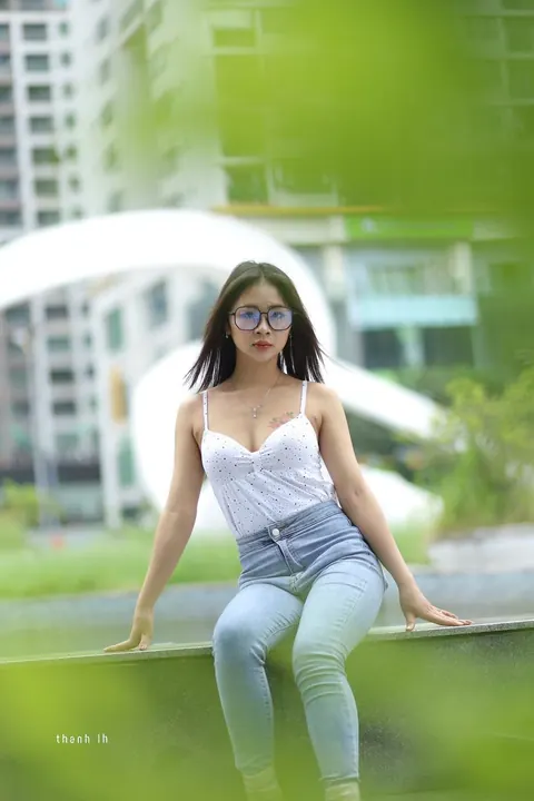 Asian Woman Poses Outdoors in Tight Jeans and a White Top – photo 5 of 21
