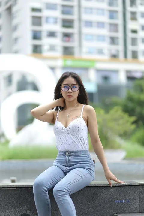 Asian Woman Poses Outdoors in Tight Jeans and a White Top – photo 9 of 21