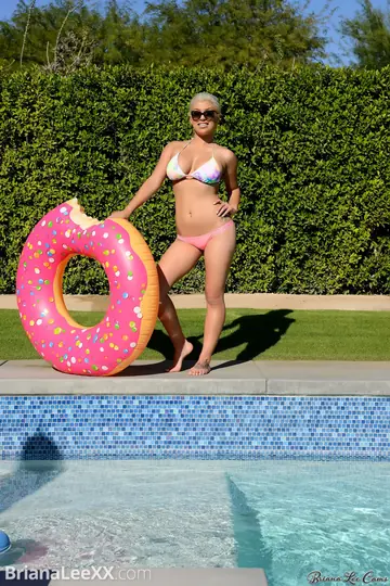 Busty Brunette MILF Loses Her Bikini and Poses Poolside