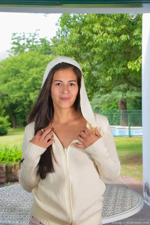 Solange: Asian Brunette with Enhanced Tits and Hairy Bush Strips Nude – photo 3 of 21
