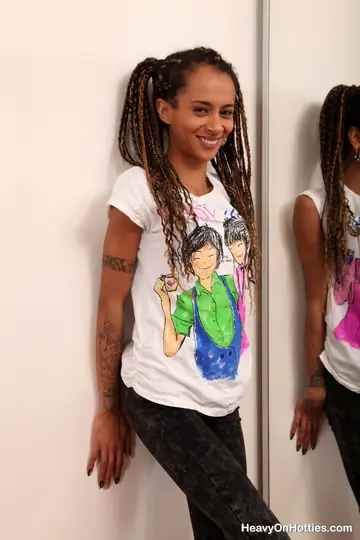 Skinny Ebony Babe with Dreadlocks Strips Naked and Poses