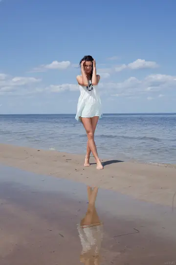 Woman Undresses and Spreads Her Legs on the Beach