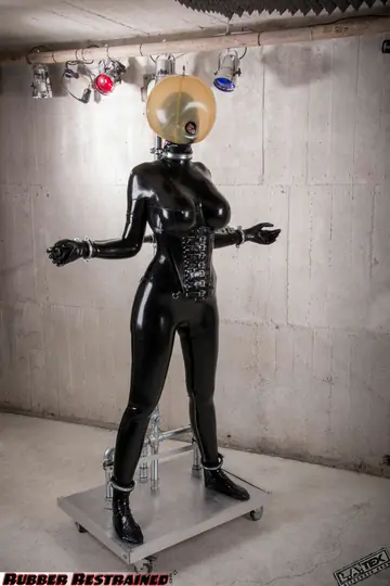 Dutch Fetish Model Restrained in Latex and High Heels