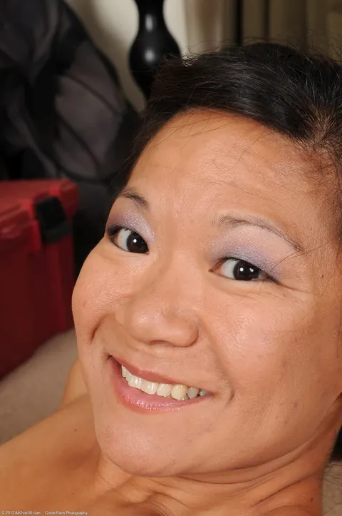 Petite Asian MILF Pulls Panties Aside to Show Her Hairy Pussy – photo 17 of 20