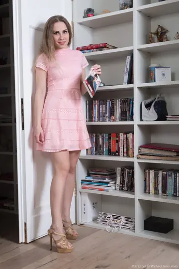 Woman Hikes Up Her Dress and Pulls Aside Her Panties