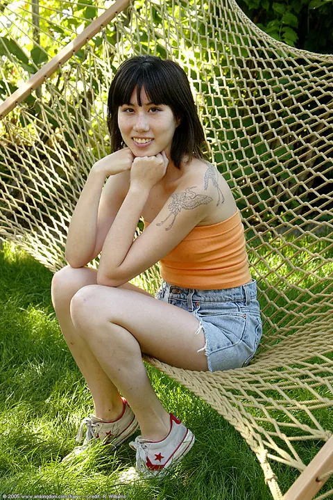 Asian Woman Pulls Panties Aside to Spread Her Hairy Pussy Outdoors – photo 1 of 16