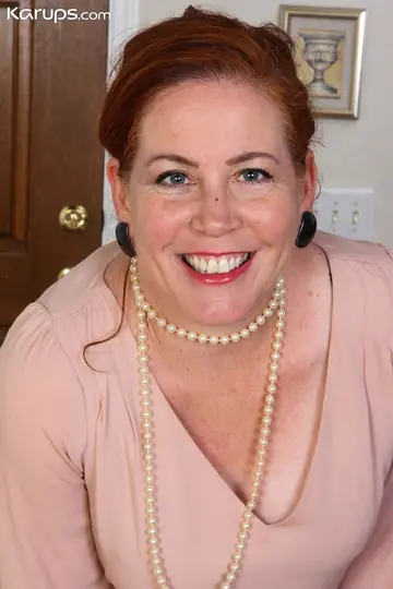 Chubby Mature Redhead with Big Tits Strips and Spreads Her Shaved Pussy