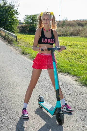 Woman in Pigtails Strips on Her Scooter and Spreads Outdoors