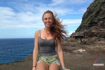 Blonde Amateur Poses in a Top and Shorts on the Beach