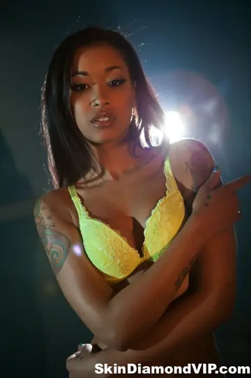 Skin Diamond – Ebony Brunette Models Yellow Lingerie and Pulls Panties Aside