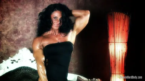 Debbie Bramwell: Thick Brunette MILF Flexes Her Muscles and Big Ass in a Bikini and Dress – photo 3 of 21