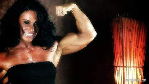 Debbie Bramwell: Thick Brunette MILF Flexes Her Muscles and Big Ass in a Bikini and Dress – photo 17 of 21
