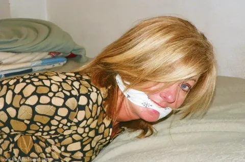 Blonde MILF in Shorts and Heels Bound and Spread on the Bed – photo 3 of 16