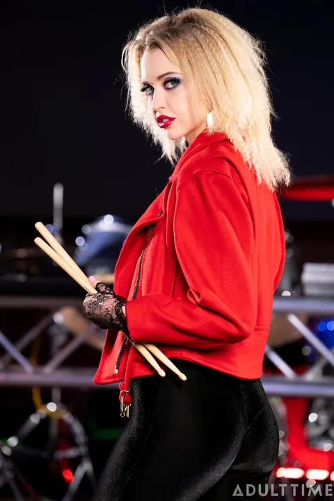 Charlotte Stokely: Busty Blonde and Brunette Kiss in Leather Skirts on Stage – photo 8 of 15