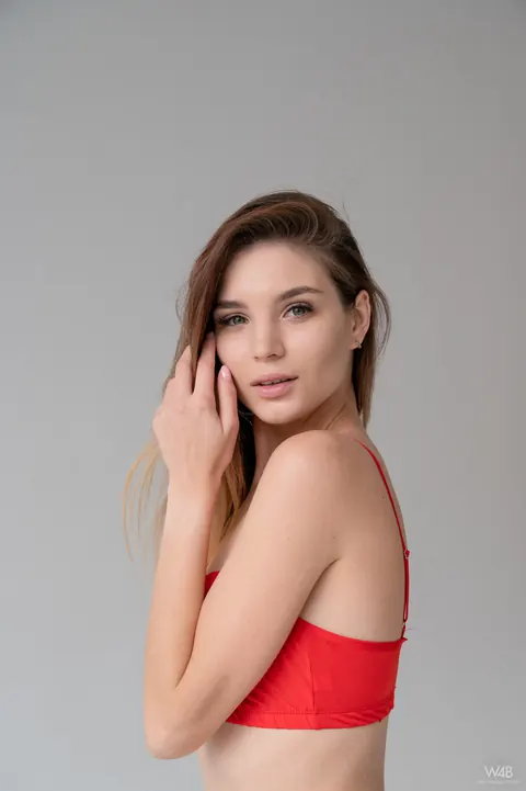 Emilia Hops: Skinny Brunette Strips Out of Her Red Lingerie – photo 1 of 21
