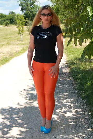 Curvy German MILF in Orange Yoga Pants and Pantyhose Shows Her Ass Outdoors