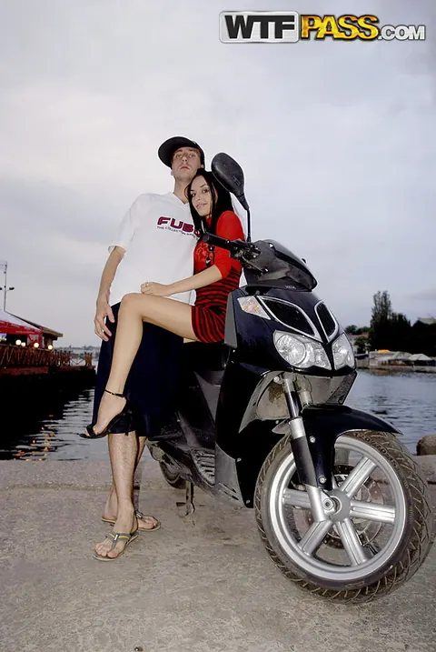 Tall Brunette Flashes Her Long Legs in a Skirt and Heels Outdoors – photo 11 of 16