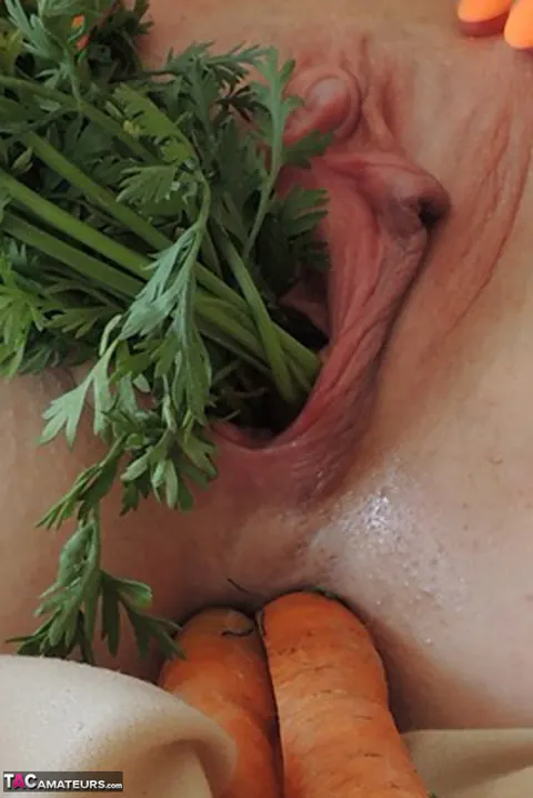 Busty Blonde MILF Penetrates Both Holes with Vegetables – photo 14 of 16