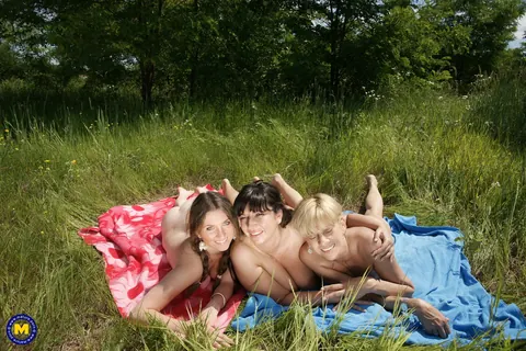 Brunette MILF Undresses for Lesbian Threesome Outdoors – photo 21 of 21