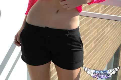 Busty Babe in Lingerie and Shorts Spreads Her Legs on the Balcony – photo 6 of 12