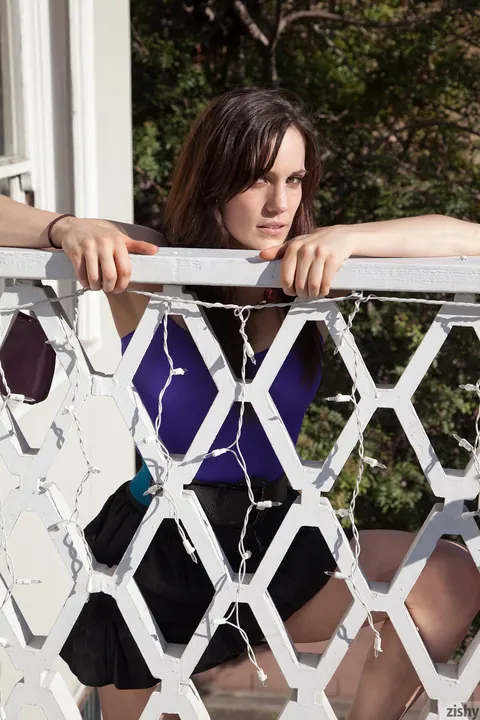 Erin Marie: Busty PAWG in Shorts Flashes Her Ass on a Balcony Chair – photo 5 of 11