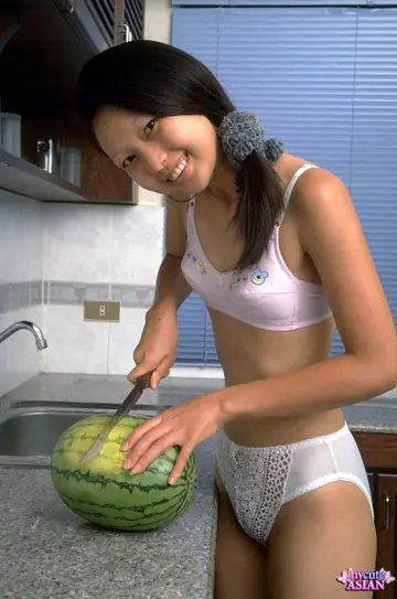 Lin Si Yee – Thai Brunette Eats Watermelon and Strips in the Kitchen