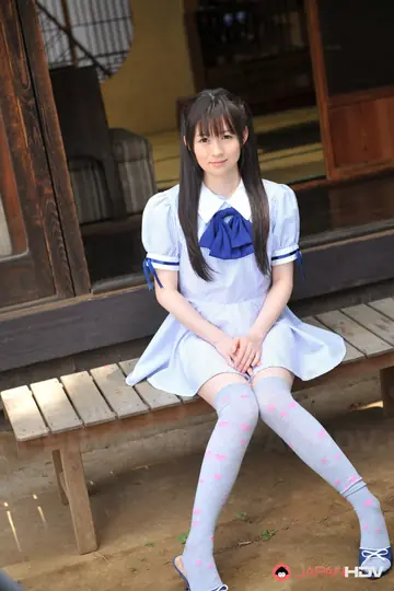 Ai Uehara – Asian Woman in Pigtails Teases in a Skirt on the Balcony