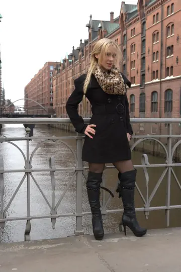 Blonde European Flaunts Her Enhanced Tits in Boots