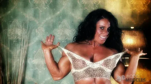 Debbie Bramwell: Brunette MILF Flexes Her Muscles and Shows Pierced Belly in the Gym – photo 10 of 21