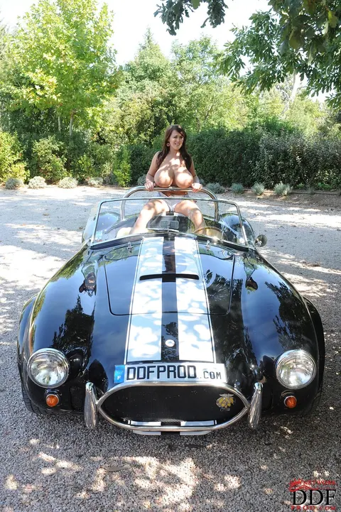 Leanne Crow: Thick European Brunette with Big Tits Poses in Lingerie by a Car – photo 16 of 21