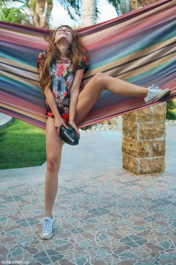 Brunette Rubs a Football Against Her Pussy Outdoors
