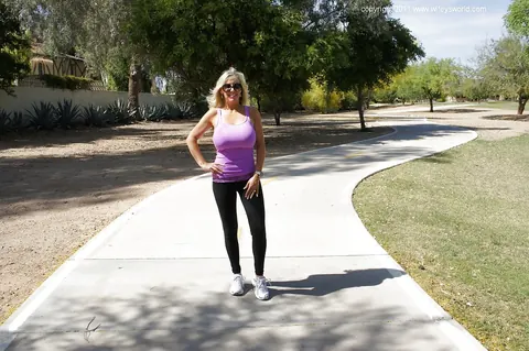 Sandra Otterson: Curvy Blonde MILF in Yoga Pants and Glasses Poses Outdoors – photo 13 of 16