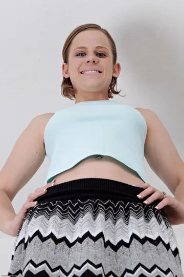 Petite Short-Haired Brunette in a Skirt Shows Panties and Spreads Her Asshole