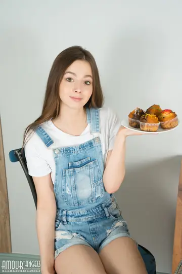 Woman Strips Out of Denim Overalls and Shorts to Show Her Shaved Pussy