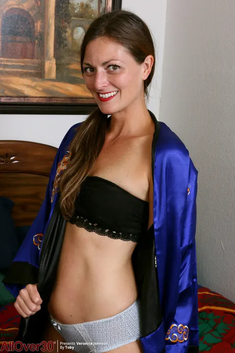 Veronica Johnson: Hairy Brunette MILF in Pigtails Uses a Dildo and Spreads Her Bush on the Bed – photo 2 of 16